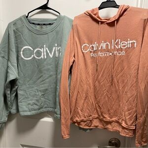 Calvin Klein Green Sweatshirt and Orange Hoodie (cropped)